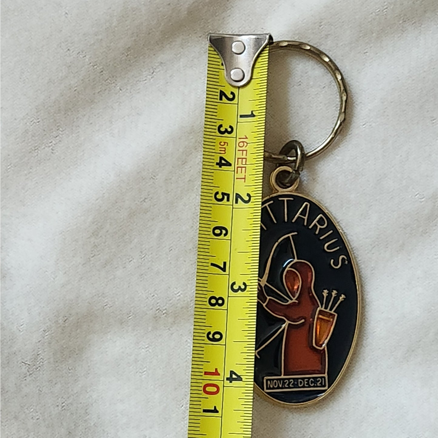 1970s  Enamel and Brass Sagittarius Key Ring